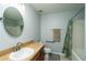Cozy bathroom featuring a vanity sink, toilet, and shower with curtain at 1813 Sw 157Th Place Rd, Ocala, FL 34473