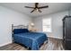 Bedroom featuring a window with natural light, a ceiling fan, and wood-look flooring at 1813 Sw 157Th Place Rd, Ocala, FL 34473