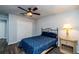 Bedroom featuring a large closet, a ceiling fan, and wood-look flooring at 1813 Sw 157Th Place Rd, Ocala, FL 34473
