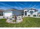 Charming single-story home with a well-manicured lawn and a decorative rock garden with a deer statue at 1813 Sw 157Th Place Rd, Ocala, FL 34473