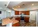 Well-appointed kitchen with stainless steel appliances, and a breakfast bar overlooking the living area at 1813 Sw 157Th Place Rd, Ocala, FL 34473