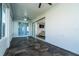 This covered lanai offers tiled flooring and a ceiling fan, with an open sliding glass door that leads into the living room at 1813 Sw 157Th Place Rd, Ocala, FL 34473