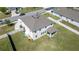Aerial shot of home showcasing its ample backyard, cozy covered patio, and well-kept lawn at 1861 Ne 50Th Ter, Ocala, FL 34470