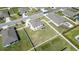 This aerial shot emphasizes the property's well-maintained lawn, fencing, and pleasant neighborhood setting at 1861 Ne 50Th Ter, Ocala, FL 34470