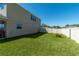 Large, fenced backyard with well-maintained lawn, offering privacy and plenty of space at 1861 Ne 50Th Ter, Ocala, FL 34470