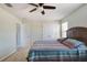 Bedroom features a ceiling fan, and neutral walls, creating a calming retreat at 1861 Ne 50Th Ter, Ocala, FL 34470