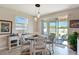 Bright dining area with sliding glass doors to the patio and a charming round table at 1861 Ne 50Th Ter, Ocala, FL 34470
