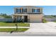 Two-story home featuring a two-car garage, covered front porch, neutral color palette and well-maintained landscaping at 1861 Ne 50Th Ter, Ocala, FL 34470