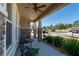 Inviting front porch featuring stone accents, a cozy seating area, and well-maintained landscaping at 1861 Ne 50Th Ter, Ocala, FL 34470