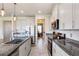 Modern kitchen features granite countertops, stainless steel appliances, white subway tile backsplash and recessed lighting at 1861 Ne 50Th Ter, Ocala, FL 34470