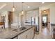 Modern kitchen features granite countertops, stainless steel appliances, pendant lighting, and tile flooring at 1861 Ne 50Th Ter, Ocala, FL 34470