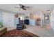 Comfortable living area with ceiling fan, plush furniture, and views of the staircase and upper landing at 1861 Ne 50Th Ter, Ocala, FL 34470