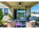 Relaxing covered patio with comfortable seating and stylish decor, ideal for outdoor living at 1861 Ne 50Th Ter, Ocala, FL 34470