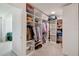 Spacious walk-in closet with custom shelving and ample storage for clothes and accessories at 1861 Ne 50Th Ter, Ocala, FL 34470