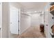 Large walk-in closet with adjustable wire shelving and carpet flooring at 1861 Ne 50Th Ter, Ocala, FL 34470