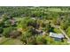Aerial view of a property with acreage outlined in red showing lot lines and surrounding greenery at 2130 Sw 37Th Street Rd, Ocala, FL 34471