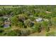 Aerial view of a property outlined in red showing lot lines and surrounded by mature trees at 2130 Sw 37Th Street Rd, Ocala, FL 34471