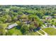 Aerial view of a home with acreage outlined in red showing lot lines and surrounding greenery at 2130 Sw 37Th Street Rd, Ocala, FL 34471