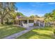 Backyard view of a home with well-maintained landscaping, a patio, and ample privacy at 2130 Sw 37Th Street Rd, Ocala, FL 34471