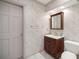 Updated bathroom features marble vanity with a storage cabinet at 2130 Sw 37Th Street Rd, Ocala, FL 34471