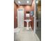 A quaint bathroom boasts a pedestal sink, tiled floors, and a glass-door shower at 2130 Sw 37Th Street Rd, Ocala, FL 34471