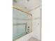 This bright bathroom features tiled walls and glass shower doors with gold trim at 2130 Sw 37Th Street Rd, Ocala, FL 34471