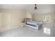 Spacious bedroom featuring a tufted headboard, marble floors, and a window for natural light at 2130 Sw 37Th Street Rd, Ocala, FL 34471