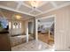 Inviting foyer with tile floors, coffered ceilings, decorative mirror, and entry door with sidelights at 2130 Sw 37Th Street Rd, Ocala, FL 34471