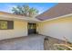 Charming front entrance with brick pavers, decorative door with wreath, and well-maintained landscaping at 2130 Sw 37Th Street Rd, Ocala, FL 34471
