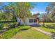 Home with lovely landscaping in front of the house; a nice walkway leads up to the entrance at 2130 Sw 37Th Street Rd, Ocala, FL 34471