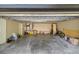 An inside view of the garage shows ample space for storage, as well as tools and vehicles at 2130 Sw 37Th Street Rd, Ocala, FL 34471