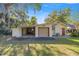 The detached garage has covered parking, an enclosed garage, and a side door at 2130 Sw 37Th Street Rd, Ocala, FL 34471