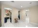 Hallway features marble floors and leads to multiple walk-in closets and dressing rooms at 2130 Sw 37Th Street Rd, Ocala, FL 34471