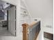 Second story hallway featuring a built-in bookcase and railing at 2130 Sw 37Th Street Rd, Ocala, FL 34471