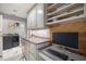 This laundry room features plenty of shelving, counter space, and a sink with a view of the laundry machines at 2130 Sw 37Th Street Rd, Ocala, FL 34471