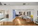 Open-concept space showcasing hardwood floors leading to kitchen and dining areas at 2130 Sw 37Th Street Rd, Ocala, FL 34471