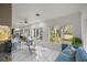 Sunroom with marble flooring and views of the surrounding landscaping at 2130 Sw 37Th Street Rd, Ocala, FL 34471