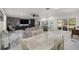 Living room and dining room showcasing marble floors at 2130 Sw 37Th Street Rd, Ocala, FL 34471