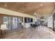 Expansive tiled patio with ceiling fans and an outdoor kitchen with stainless steel appliances at 2130 Sw 37Th Street Rd, Ocala, FL 34471