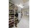 Walk-in closet features shelving with storage for shoes and other items at 2130 Sw 37Th Street Rd, Ocala, FL 34471
