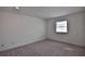 Clean bedroom featuring carpeted floors and a window at 2881 Se 41St Pl, Ocala, FL 34480
