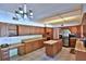 Well-lit kitchen features wooden cabinets, an island with countertop, and stainless steel appliances at 2881 Se 41St Pl, Ocala, FL 34480