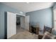 Office or bedroom space complete with a desk and seating at 29496 Caspian St, Leesburg, FL 34748