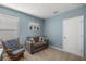 Cozy bedroom with a comfortable chair and couch at 29496 Caspian St, Leesburg, FL 34748