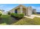 Charming single-Gathering home featuring a landscaped front yard and covered porch at 29496 Caspian St, Leesburg, FL 34748
