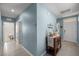 Hallway with a small table and view to the bedrooms at 29496 Caspian St, Leesburg, FL 34748