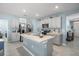 Kitchen area with center island and stainless-steel appliances at 29496 Caspian St, Leesburg, FL 34748