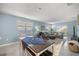 Open concept living room with dining area and abundant natural light at 29496 Caspian St, Leesburg, FL 34748