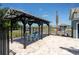 Community outdoor cabana with seating offers a place to relax and cool off by the pool at 29496 Caspian St, Leesburg, FL 34748