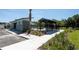 A pool cabana and building provide a relaxing shaded outdoor space for residents at 29496 Caspian St, Leesburg, FL 34748